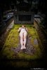 Naked Dead Girl on an Old Grave
