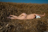 Naked Woman Lying Down in the Wheat Field